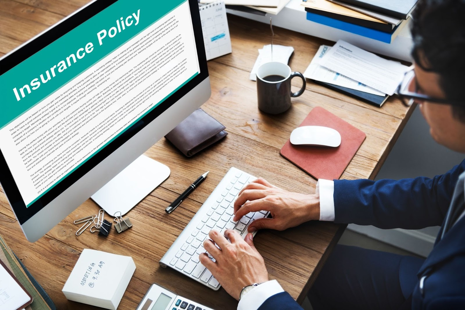 A person gaining knowledge about excess liability coverage on a computer.
